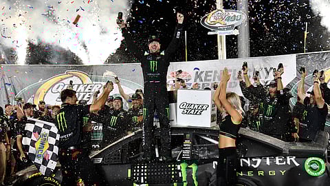 Kurt Busch celebrates his win in the NASCAR Cup Series auto race at Kentucky Speedway in Sparta, Ky., Saturday, July 13, 2019. (AP Photo/Timothy D. Easley)