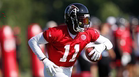 Atlanta Falcons wide receiver Julio Jones (11) runs after a catch during their NFL training camp football practice Thursday, July 25, 2019, in Flowery Branch, Ga. (AP Photo/John Bazemore)