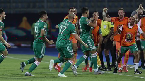 Algerian players celebrate after a goal during Group C match with Senegal on June 27 (Hassan Ammar)