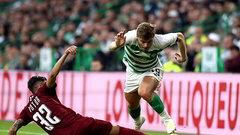 FK Sarajevo's Benjamin Tatar, left, and Celtic's James Forrest battle for the ball during the Champions League first qualifying round, second leg soccer match at Celtic Park, Glasgow, Scotland, Wednesday July 17, 2019.