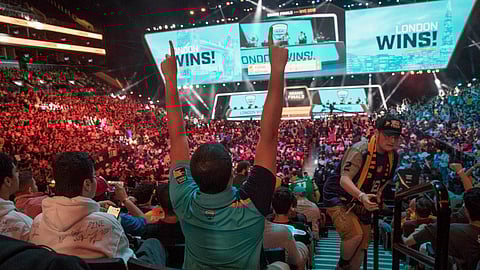 FILE - In this July 28, 2018, file photo, London Spitfire fan Rick Ybarra, of Plainfield, Ind., reacts after London won the second game against the Philadelphia Fusion during the Overwatch League Grand Finals competition at Barclays Center in New York. (AP Photo/Mary Altaffer, File)