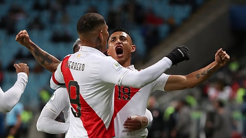 Peru’s Victor Yotun, right, celebrates scoring his side’s second goal with teammate Paolo Guerrero during a Copa America semifinal soccer match against Chile at the Arena do Gremio in Porto Alegre, Brazil, Wednesday, July 3, 2019. (AP Photo/Ricardo Mazalan)