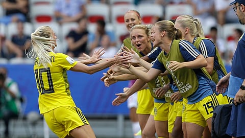 Sweden’s Sofia Jakobsson, left, celebrates after scoring her side’s second goal during the Women’s World Cup third place soccer match between England and Sweden at Stade de Nice, in Nice, France, Saturday, July 6, 2019. (AP Photo/Claude Paris)