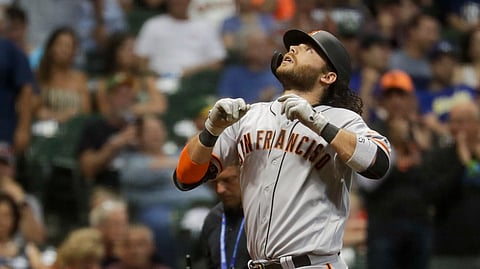 San Francisco Giants' Brandon Crawford reacts after hitting a home run during the ninth inning of a baseball game against the Milwaukee Brewers Friday, July 12, 2019, in Milwaukee. (AP Photo/Morry Gash)