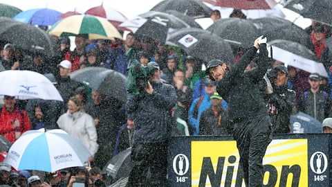 England's Tommy Fleetwood tees off the 9th tee hole in heavy rain during the final round of the British Open Golf Championships at Royal Portrush in Northern Ireland, Sunday, July 21, 2019.