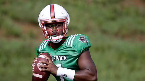 FILE - In this Aug. 6, 2019, file photo, North Carolina State quarterback Matthew McKay is shown during an NCAA college football practice in Raleigh, N.C. McKay will start the season at quarterback for North Carolina State. The redshirt sophomore was listed atop the depth chart released Monday, Aug. 26, 2019, for the Wolfpack's opener against East Carolina.(AP Photo/Gerry Broome, File)