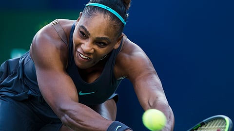 Serena Williams, of the United States, reaches for a shot from Naomi Osaka, of Japan, during the Rogers Cup women’s tennis tournament Friday, Aug. 9, 2019, in Toronto. (Nathan Denette/The Canadian Press via AP)