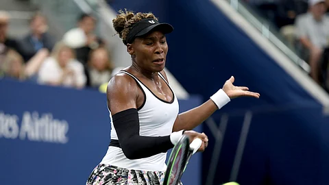 Venus Williams, of the United States, returns a shot to Elina Svitolina, of Ukraine, during the second round of the US Open tennis championships Wednesday, Aug. 28, 2019, in New York.