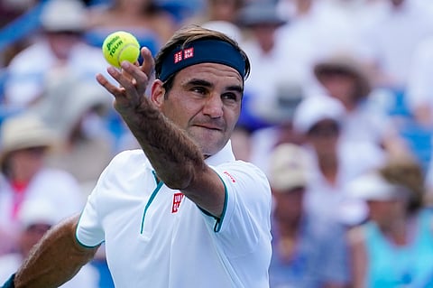 Roger Federer, of Switzerland, serves to Andrey Rublev, of Russa, during the quarterfinals of the Western & Southern Open tennis tournament, Thursday, Aug. 15, 2019, in Mason, Ohio. (AP Photo/John Minchillo)