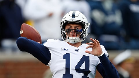 In this Nov. 3, 2018, file photo, Penn State quarterback Sean Clifford (14) warms up before an NCAA college football game against Michigan in Ann Arbor, Michigan.