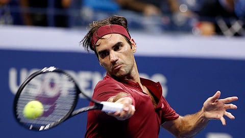FILE - In this Sept. 4, 2018, file photo, Roger Federer, of Switzerland, returns a shot to John Millman, of Australia, during the fourth round of the U.S. Open tennis tournament in New York. Federer is ranked No. 3 leading into the U.S. Open, where he won the most recent of his five titles there in 2008. (AP Photo/Jason DeCrow, File)