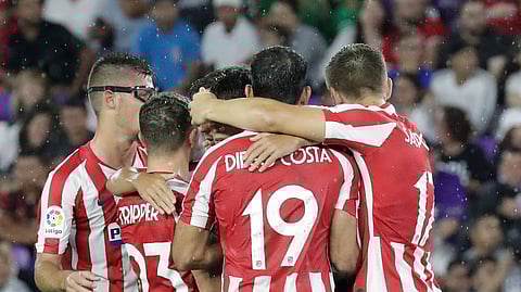 Atletico Madrid forward Joao Felix is surrounded by teammates after scoring a goal against the MLS All-Stars in a soccer match Wednesday, July 31, 2019, in Orlando, Florida.