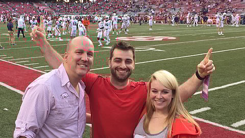 Yasin Abbak, center, with members of the Fantasy Life team, Scott Davis and Stacy Sailer.