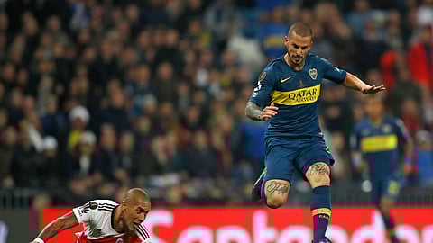 ILE - In this Sunday, Dec. 9, 2018 file photo Dario Benedetto of Argentina's Boca Juniors, right, runs with the ball to score against Argentina's River Plate. Benedetto is now playing for Marseille. (AP Photo/Thanassis Stavrakis, File)