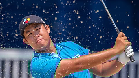 Byeong Hun An blasted out for a tip-in putt on the 18th hole at the Wyndham Championship at Sedgefield Country Club in Greensboro, NC on Aug. 1, 2019. (H. Scott Hoffmann/News & Record)