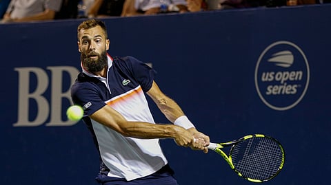 Benoit Paire, of France, hits a return to Steve Johnson, of the United States, during the Winston-Salem Open tennis tournament in Winston-Salem, N.C., Friday, Aug. 23, 2019. (AP Photo/Nell Redmond)