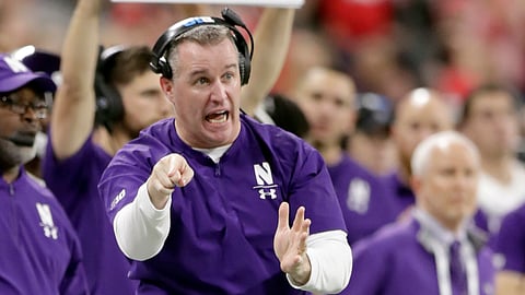 FILE - In this Dec. 1, 2018, file photo, Northwestern head coach Pat Fitzgerald directs his team from the sidelines during the second half of the Big Ten championship NCAA college football game against Ohio State in Indianapolis. It seems no one is talking about Northwestern even though it won the Big Ten West last year. The chatter surely will start if the Wildcats beat the Cardinal on the road Saturday. (AP Photo/Michael Conroy, File)