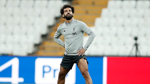 Liverpool's Mohamed Salah stretches during a training session at the Besiktas Park Stadium, in Istanbul, Tuesday, Aug. 13, 2019. The winners of Champions League, Liverpool and Europa League, Chelsea will play at the Super Cup soccer match on Wednesday.