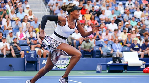 Venus Williams, of the United States, chases down a shot from Zheng Saisai, of China, during the first round of the US Open tennis tournament Monday, Aug. 26, 2019, in New York. (AP Photo/Eduardo Munoz Alvarez)