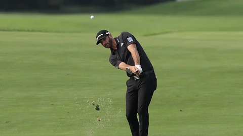 Dustin Johnson drives to the 12th hole in the Northern Trust tournament at Liberty National Golf Course, Thursday, Aug. 8, 2019, in Jersey City, N.J. (AP Photo/Mark Lennihan)