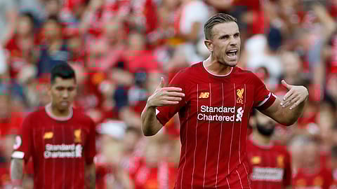 Liverpool's Jordan Henderson celebrates after the English Premier League soccer match between Liverpool and Arsenal at Anfield stadium in Liverpool, England, Saturday, Aug. 24, 2019. (AP Photo/Rui Vieira)
