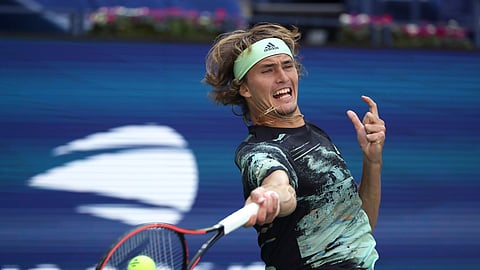 Alexander Zverev, of Germany, returns a shot to Frances Tiafoe, of the United States, during the second round of the US Open tennis championships Thursday, Aug. 29, 2019, in New York. (AP Photo/Kevin Hagen)