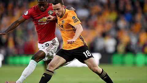 Wolverhampton, in orange, battles Torino in UEFA Europa League action.