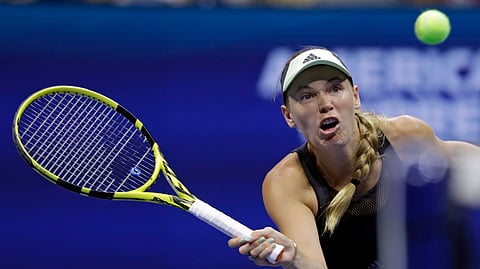 Caroline Wozniacki, of Denmark, returns a shot to Danielle Collins, of the United States, during the second round of the U.S. Open tennis tournament Thursday, Aug. 29, 2019, in New York. (AP Photo/Adam Hunger)