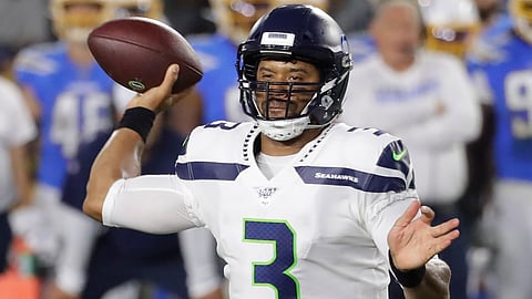 Seattle Seahawks quarterback Russell Wilson passes against the Los Angeles Chargers during the first half of an NFL preseason football game Saturday, Aug. 24, 2019, in Carson, California.