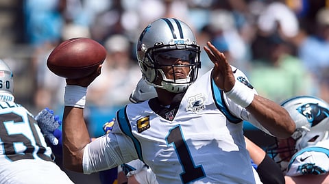 Carolina Panthers quarterback Cam Newton (1) looks to pass against the Los Angeles Rams during the first half an NFL football game in Charlotte, N.C., Sunday, Sept. 8, 2019.