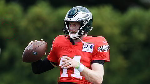 Philadelphia Eagles quarterback Carson Wentz looks to pass at the NFL football team's practice facility in Philadelphia, Wednesday, Sept. 4, 2019. (AP Photo/Matt Rourke)
