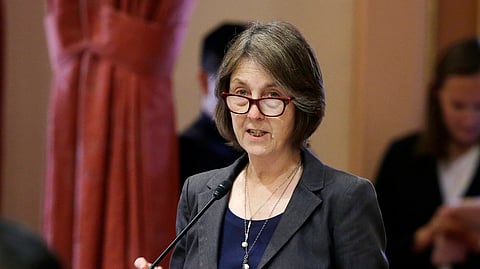 FILE - In this May 30, 2018, file photo, state Sen. Nancy Skinner, D-Berkeley, speaks on the floor of the Senate in Sacramento, Calif. The state Assembly approved Skinner's bill to let college athletes hire agents and be paid for the use of their name, images or likeness. And it would stop the universities and the NCAA from banning athletes that took the money. The bill now goes to the Senate for a final vote. (AP Photo/Rich Pedroncelli, File)