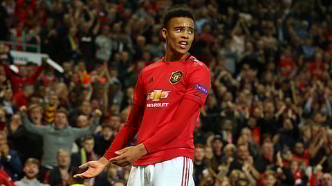 Manchester United's Mason Greenwood celebrates scoring his sides first goal during the Europa League Group L soccer match between Manchester United and Astana at Old Trafford stadium in Manchester, England Thursday, Sept. 19, 2019. (AP Photo/Dave Thompson)