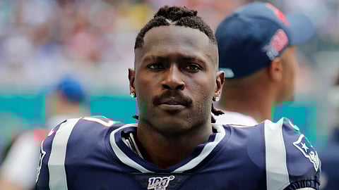 In this Sunday, Sept. 15, 2019 photo, New England Patriots wide receiver Antonio Brown (17) on the sidelines during the first half at an NFL football game against the Miami Dolphins in Miami Gardens, Fla. The Patriots released Brown on Friday, Sept. 20, 2019.