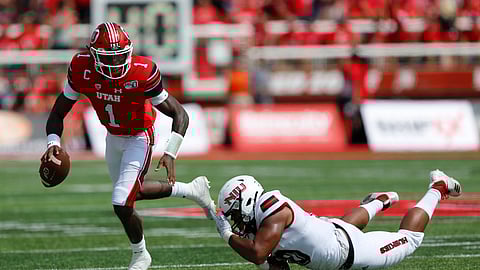 Utah quarterback Tyler Huntley (1) breaks from a Northern Illinois tackler in the first half of an NCAA college football game Saturday, Sept. 9, 2019, Salt Lake City. (AP Photo/Rick Bowmer)