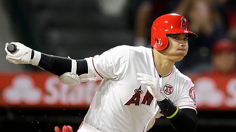 Los Angeles Angels' Shohei Ohtani, of Japan, watches a foul ball during the third inning of a baseball game against the Cleveland Indians in Anaheim, Calif., Monday, Sept. 9, 2019.