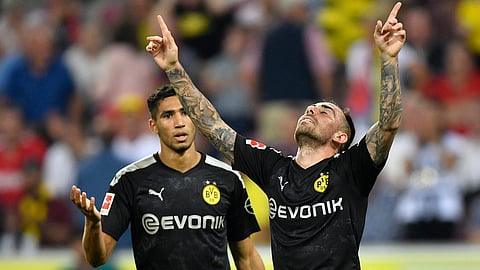 Paco Alcacer (right), shown celebrating a goal in a German Bundesliga match, will take the pitch as Spain begins qualifying Thursday (Martin Meissner)