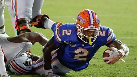 Florida running back Lamical Perine, right, dives over the goal line for a touchdown against UT Martin on a 5-yard run during the second half of an NCAA college football game, Saturday, Sept. 7, 2019, in Gainesville, Fla. (AP Photo/John Raoux)