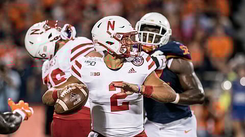 Nebraska quarterback Adrian Martinez (2) passes in the first half of an NCAA college football game against Illinois, Saturday, Sept. 21, 2019, in Champaign, Ill.