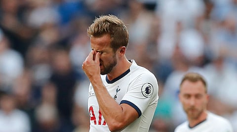 Tottenham's Harry Kane, left is dejected after missing an opportunity to score during the English Premier League soccer match between Tottenham Hotspur and Newcastle United at Tottenham Hotspur Stadium in London, Sunday, Aug. 25, 2019.