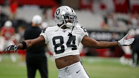 In this Aug. 15, 2019, file photo, Oakland Raiders wide receiver Antonio Brown (84) warms up for the team's NFL preseason football game against the Arizona Cardinals, in Glendale, Ariz.