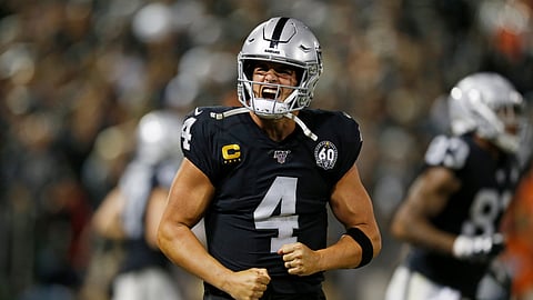 Oakland Raiders quarterback Derek Carr reacts after running back Josh Jacobs scored a touchdown during the fourth quarter of an NFL football game against the Denver Broncos Monday, Sept. 9, 2019, in Oakland, Calif. (AP Photo/D. Ross Cameron)