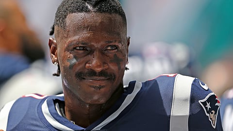 New England Patriots wide receiver Antonio Brown looks on before the start of an NFL football game against the Miami Dolphins at Hard Rock Stadium on Sunday, September 15 2019, in Miami Gardens.