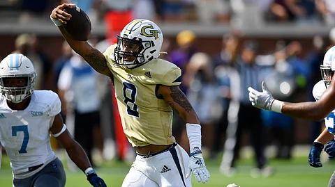 Georgia Tech quarterback Tobias Oliver (8) runs into the end zone for a touchdown during the second half of an NCAA college football game against the Citadel, Saturday, Sept. 14, 2019, in Atlanta. The touchdown was denied as Georgia Tech head coach Geoff Collins had called for a time out. The Citadel won 27-24 in overtime. (AP Photo/Mike Stewart)