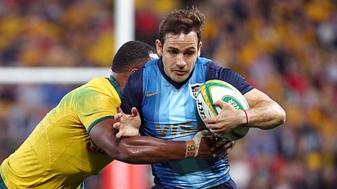 FILE - In this July 27, 2019, file photo, Argentina's Nicolas Sanchez, right, is tackled during a Rugby Championship match between Australia and Argentina in Brisbane, Australia. While Argentina has strength in depth and a powerful pack it clearly must finish better to have a chance of reaching a first Rugby World Cup final. (AP Photo/Tertius Pickard, File)