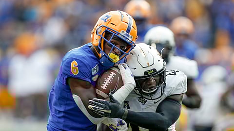 Pittsburgh wide receiver Aaron Mathews (6) tries to get away from Central Florida linebacker Nate Evans (44) after making a catch during the first half of an NCAA college football game, Saturday, Sept. 21, 2019, in Pittsburgh.