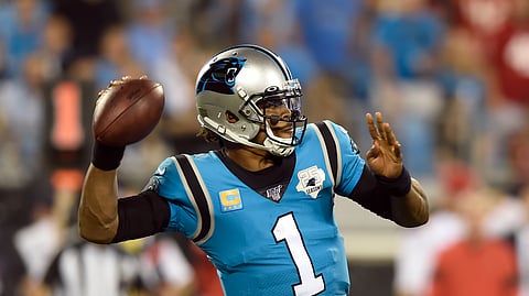 Carolina Panthers quarterback Cam Newton (1) passes against the Tampa Bay Buccaneers during the second half of an NFL football game in Charlotte, N.C., Thursday, Sept. 12, 2019.