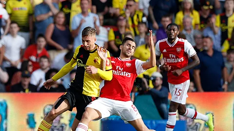 Watford's Gerard Deulofeu, left, vies for the ball with Arsenal's Dani Ceballos during their English Premier League soccer match between Watford and Arsenal at the Vicarage Road stadium in Watford near London, Sunday, Sept. 15, 2019.