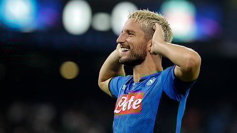 Napoli's Dries Mertens celebrates after scoring the opening goal of his team during the Champions League Group E soccer match between Napoli and Liverpool, at the San Paolo stadium in Naples, Italy, Tuesday, Sept. 17, 2019. (AP Photo/Gregorio Borgia)