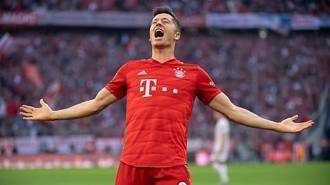 Munich's Robert Lewandowski celebrates after scoring his side second goal during the German Bundesliga soccer match between FC Bayern Munich and 1. FC Union Berlin in Munich, Saturday, Oct. 26, 2019.